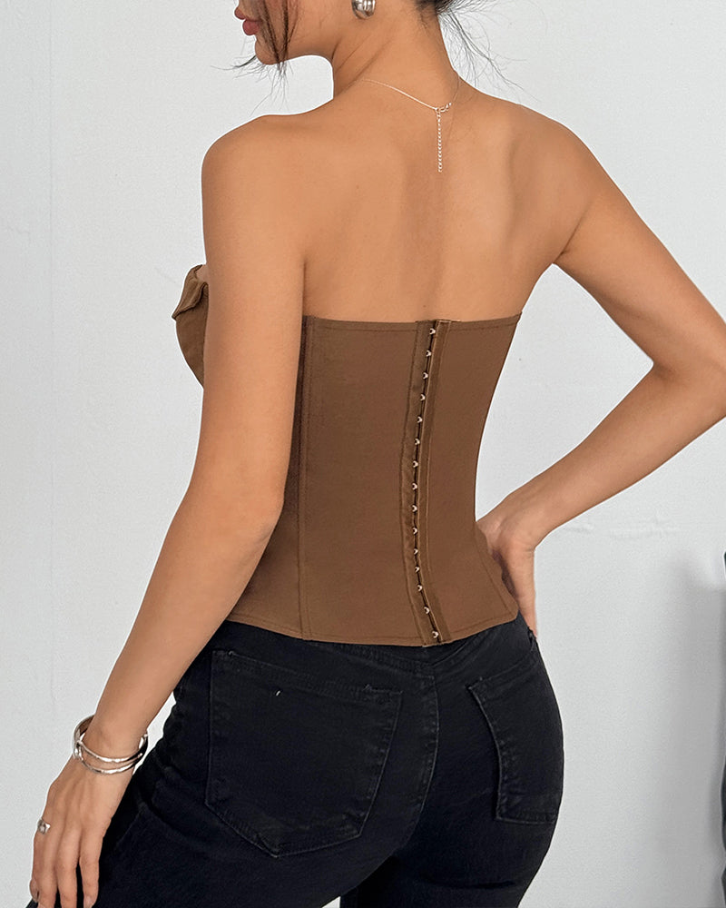 Brown strapless corset top back view with center buttoned boning panel