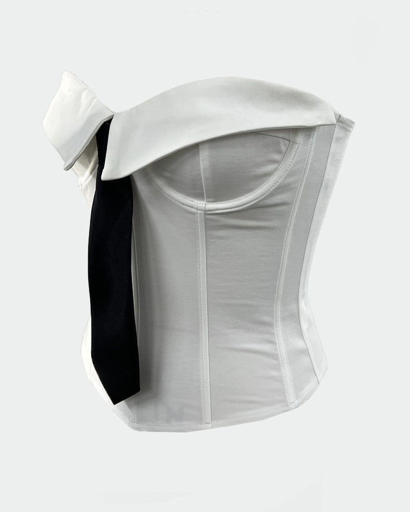 White strapless corset top with black tie ribbon detail, side view.