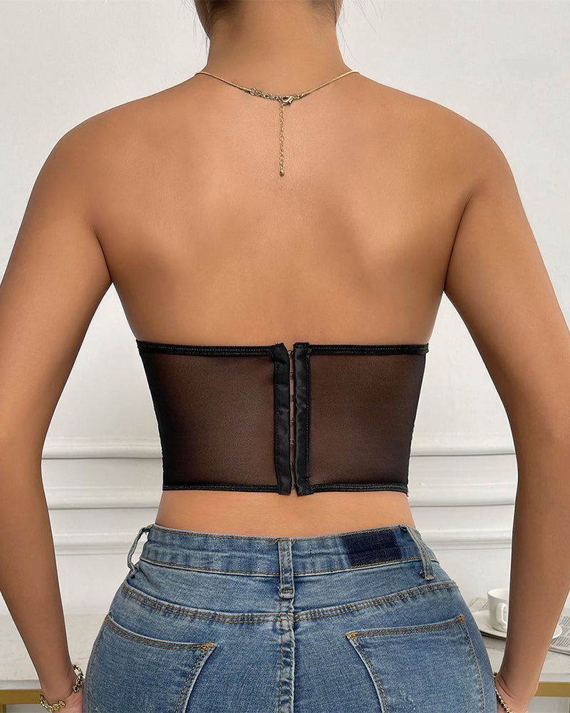 Black strapless mesh corset back view with vertical seam and clasp closure