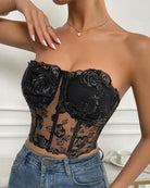 Black strapless mesh corset with floral embroidery, boned cups and sheer mid panel