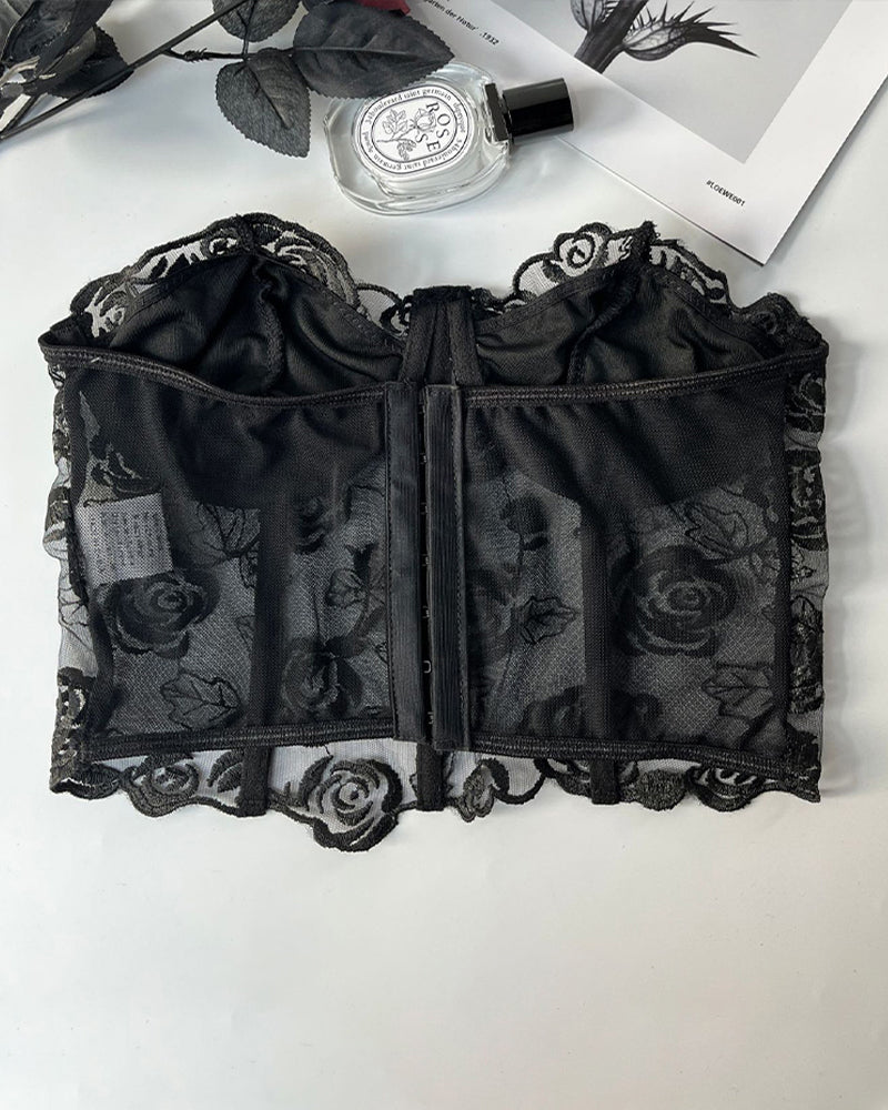 Black strapless mesh corset back flat lay with vertical center seam and clasp