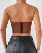 Brown strapless mesh corset back view with center seam and clasp closure