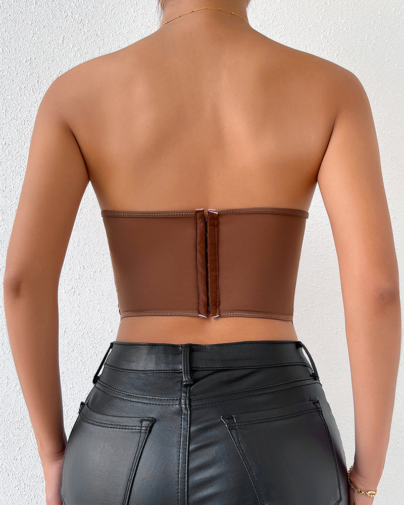 Brown strapless mesh corset back view with center seam and clasp closure