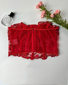 Red strapless mesh bustier with center back zipper and embroidered floral lace trim