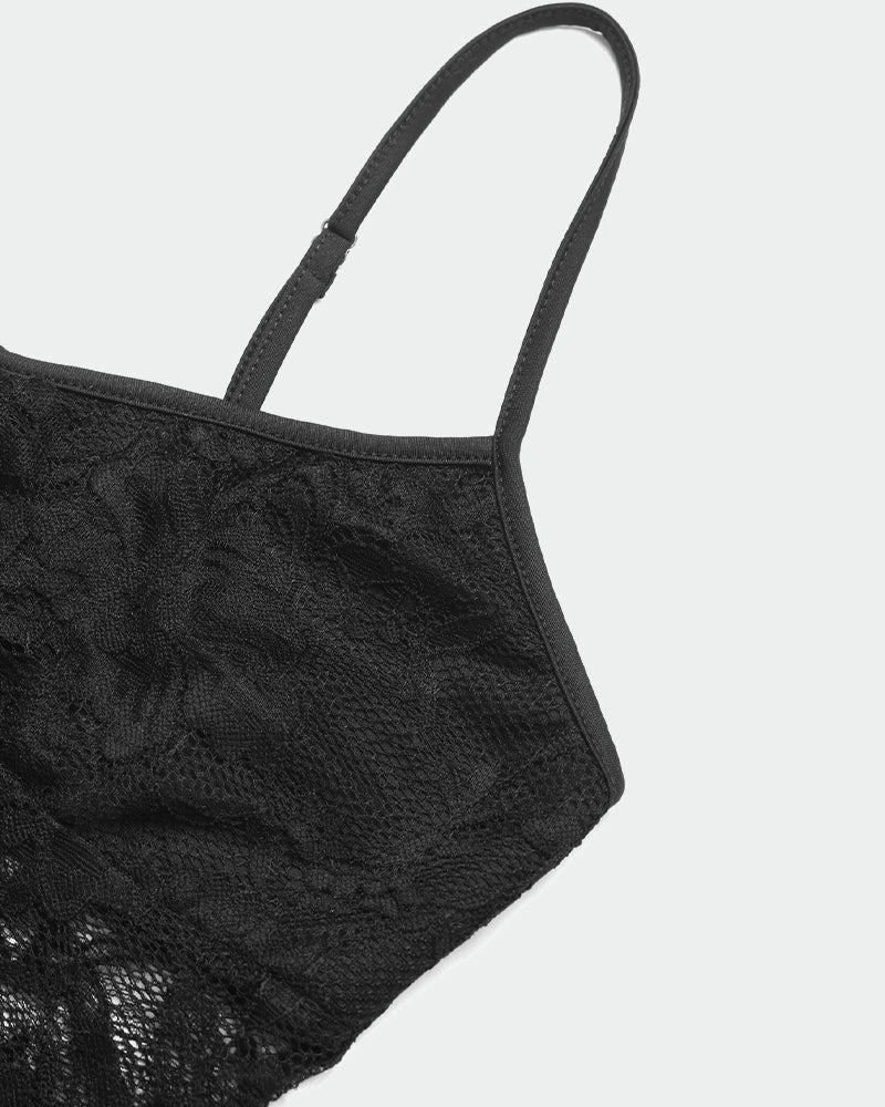 Black lace camisole with thin spaghetti strap and textured floral fabric