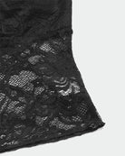 Black lace crop camisole hem with floral lace texture and scalloped trim