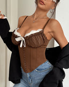 Brown corset bustier with white lace cups and lace-up front, side view