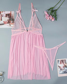 Pink lace babydoll nightdress on hanger, bowknot straps, sheer skirt with matching thong