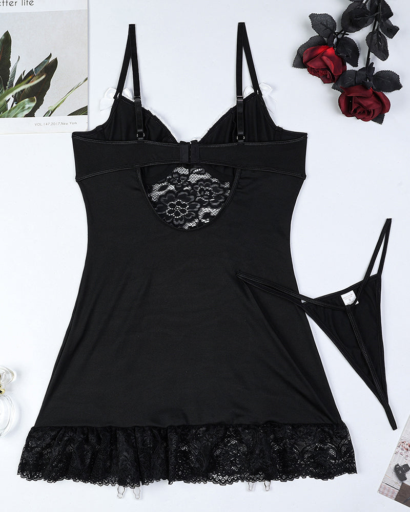 Black lace corset chemise set with bow cups and matching thong, flat lay