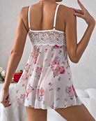 Back view of white floral babydoll lingerie set with strappy open-back design