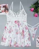 White floral babydoll lingerie set with lace cups and matching thong, laid flat
