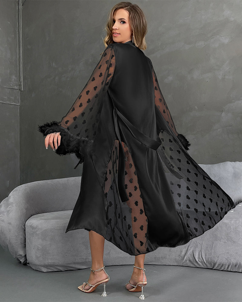Black nightgown with belt, sheer heart sleeves with feather trim, flowing side drape.