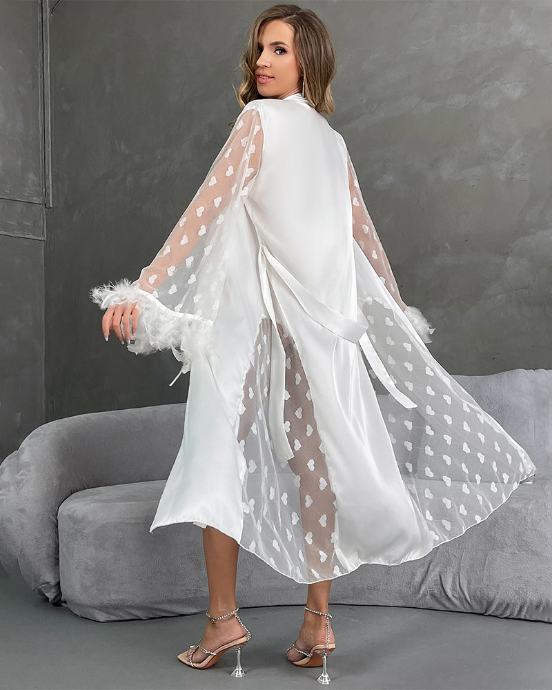 White nightgown with belt, sheer heart sleeves with feather trim, long draped back.