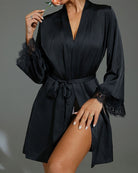 Black satin-style robe with waist belt and lace-trim cuffs