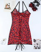 Leopard print mini dress with lace-up back ties and black trim, sleeveless