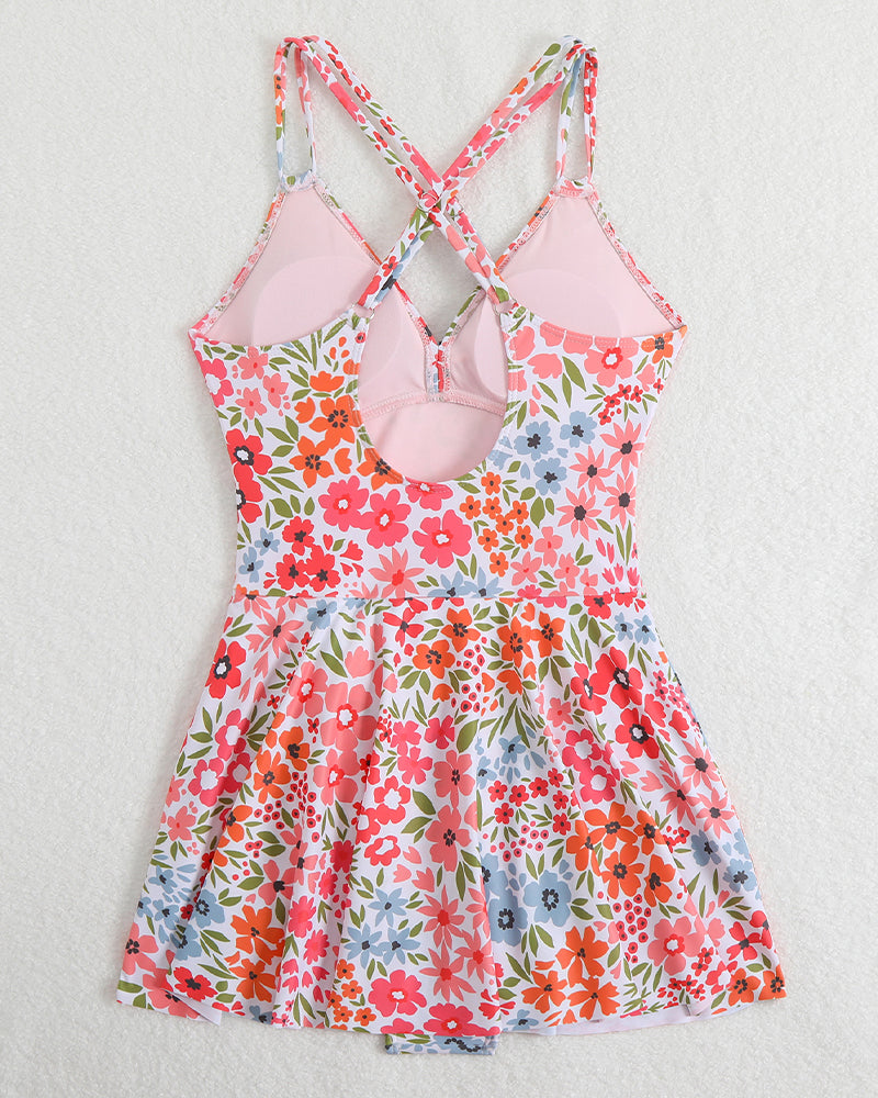 Floral print swim dress flat lay, halter V-neck, skirt with flared hem and waist tie