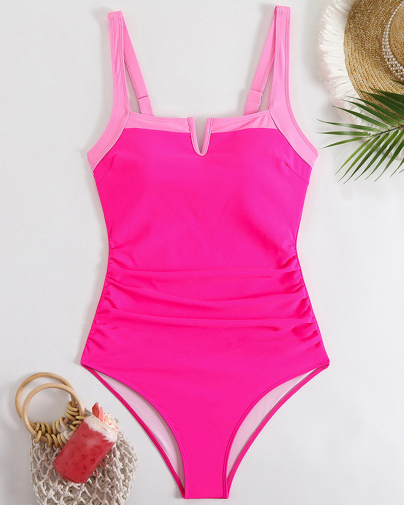 Pink one-piece swimsuit with square neckline, contrast straps, and high-leg cut