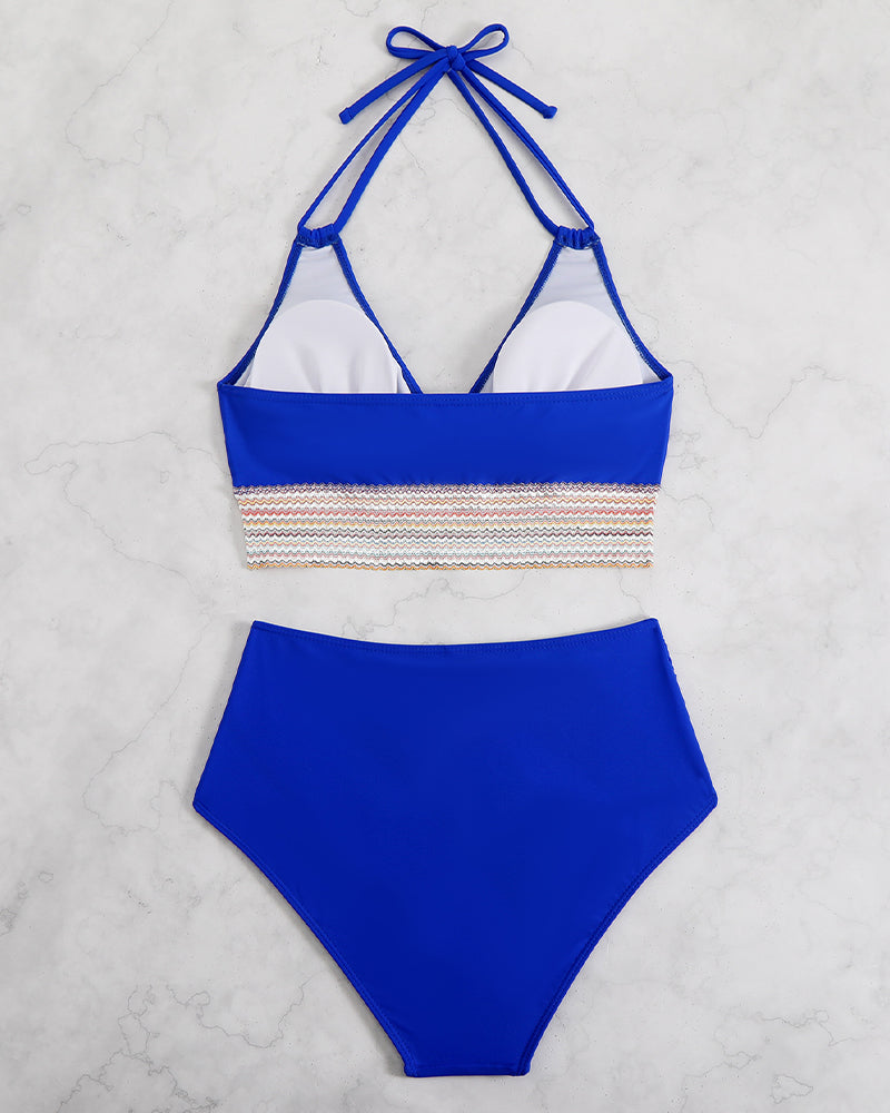 Royal blue halter bikini set with multicolor striped band and high-waist briefs