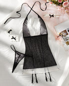 Black mesh maid lingerie set with white lace trim, matching bow cuffs and garters