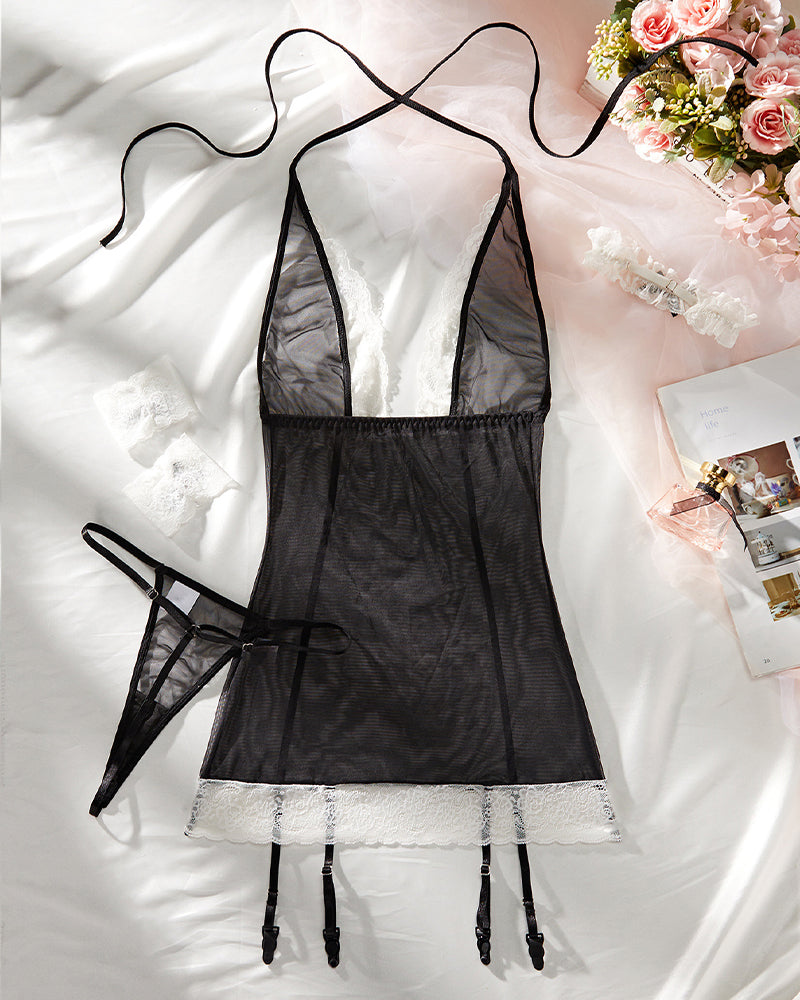 Black mesh babydoll lingerie with white lace hem and dangling garter straps