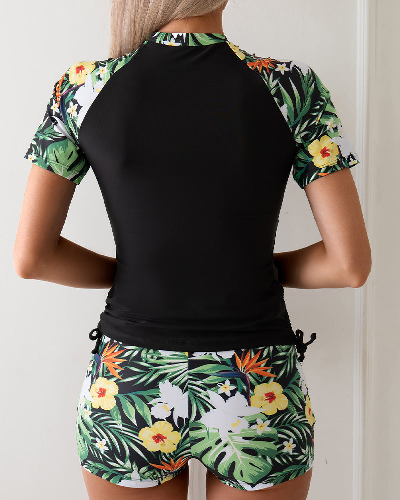 Black rash guard top and tropical floral shorts set, back view, tie waist