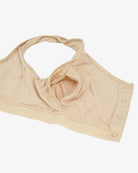 Beige non-wired bra top with scoop neckline, soft straps, and front button placket
