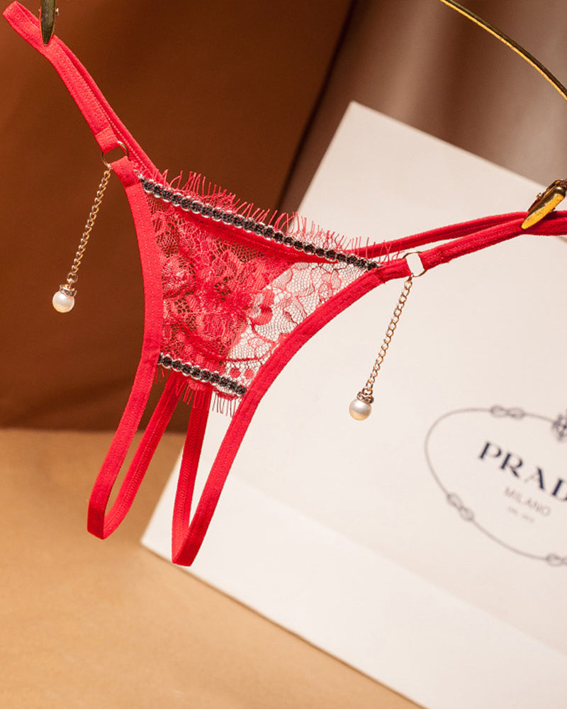 Red crotchless lace thong with pearl drop chains and black lace trim
