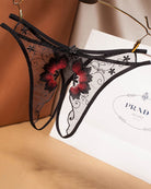Black mesh crotchless thong with red floral embroidery and lace trim