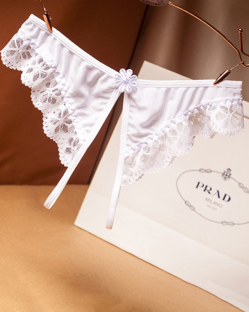 White crotchless lace low waist thong with scalloped lace trim and center flower detail