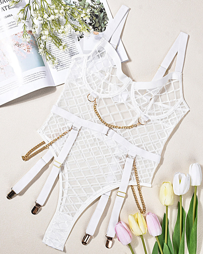 White mesh chain bodysuit on flat lay with gold-tone chains and garter straps