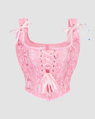 Pink corset with sweetheart neckline, floral jacquard, front lace-up, and ribbon bows