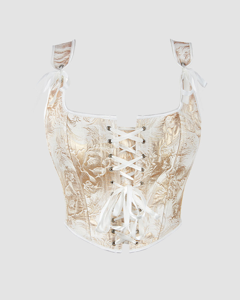 13-boned cotton corset, cream brocade with white lace-up front and satin bow ties