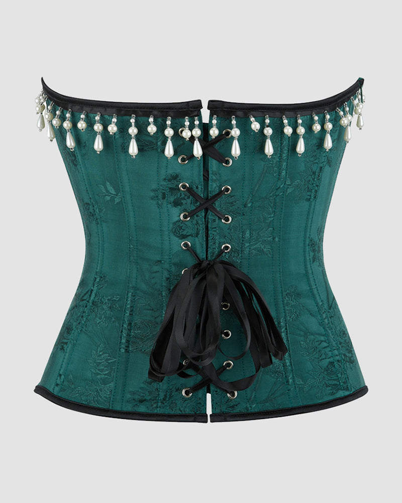 Dark green corset back with pearl-and-teardrop tassel trim and black lace-up ribbon