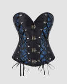 Black gothic corset with blue lace-up panels, metal eyelets, and dangling ribbon ties