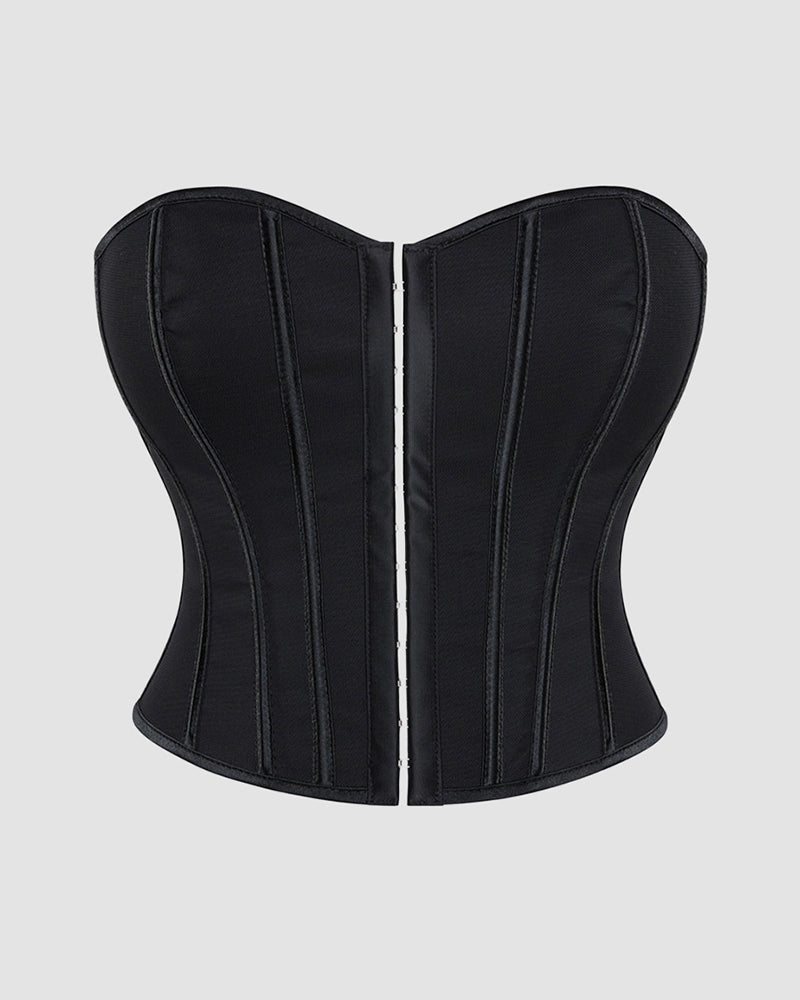 Black cotton corset with vertical boning and front busk closure, sweetheart neckline