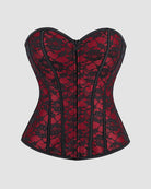 Dark red corset with black trim, panel seams, and front zipper closure