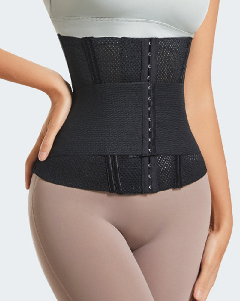 Black compression corset close-up on front band with central eyelet row fastening