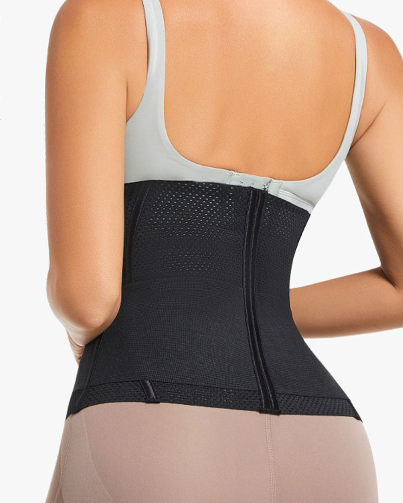Black compression corset worn, showing curved back panel and center seam