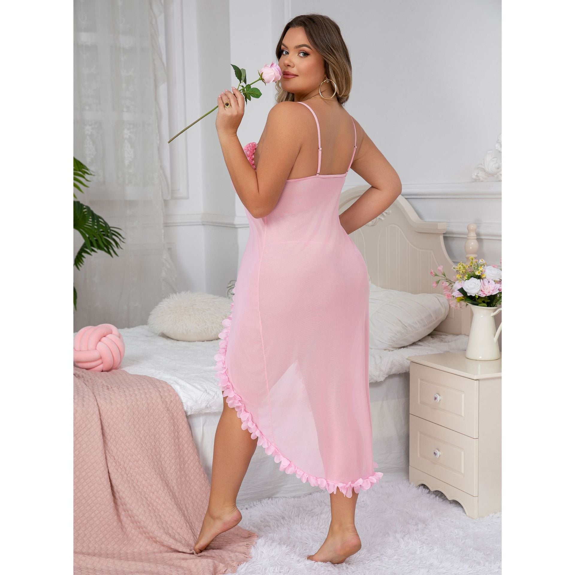 Plus size semi-sheer slit suspender dress in pink with lace-trim straps and ruffle hem