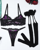 Purple skull-print lace bra, lace thong, garter straps, black lace stockings, gloves