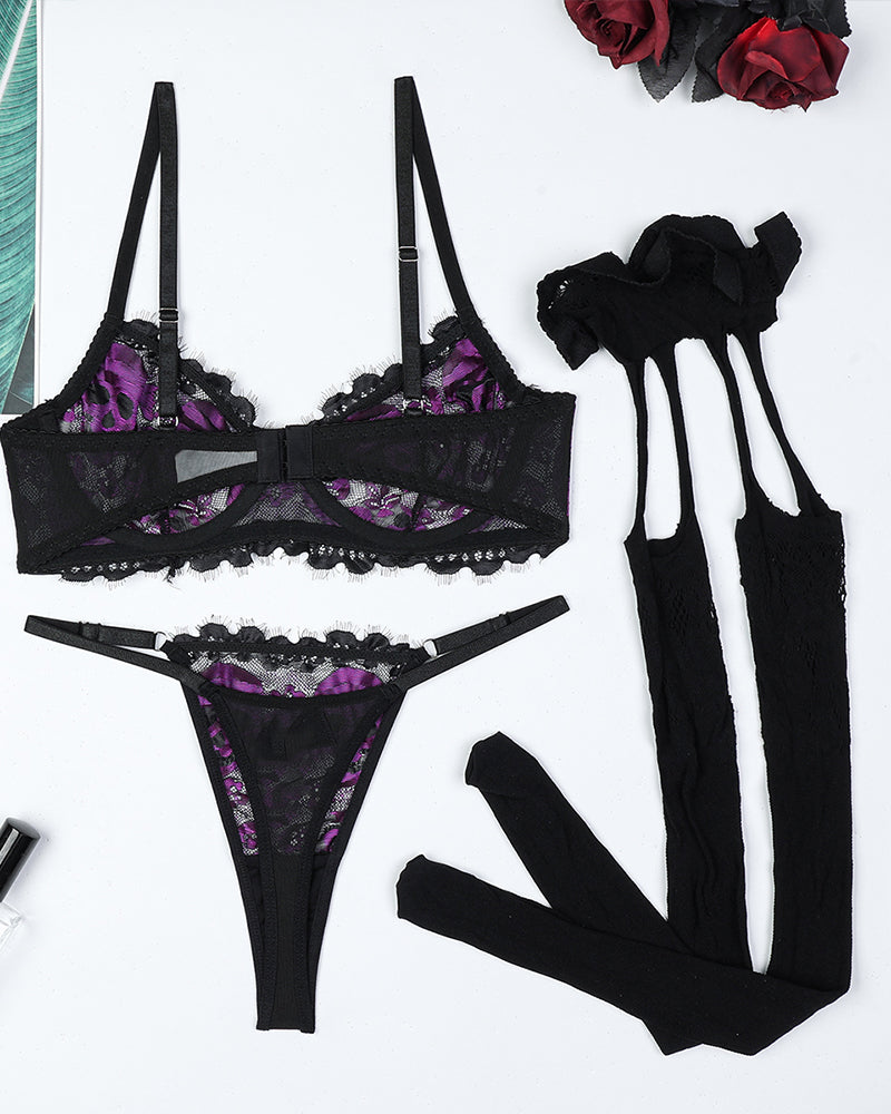 Purple skull-print lace bra, lace thong, garter straps, black lace stockings, gloves