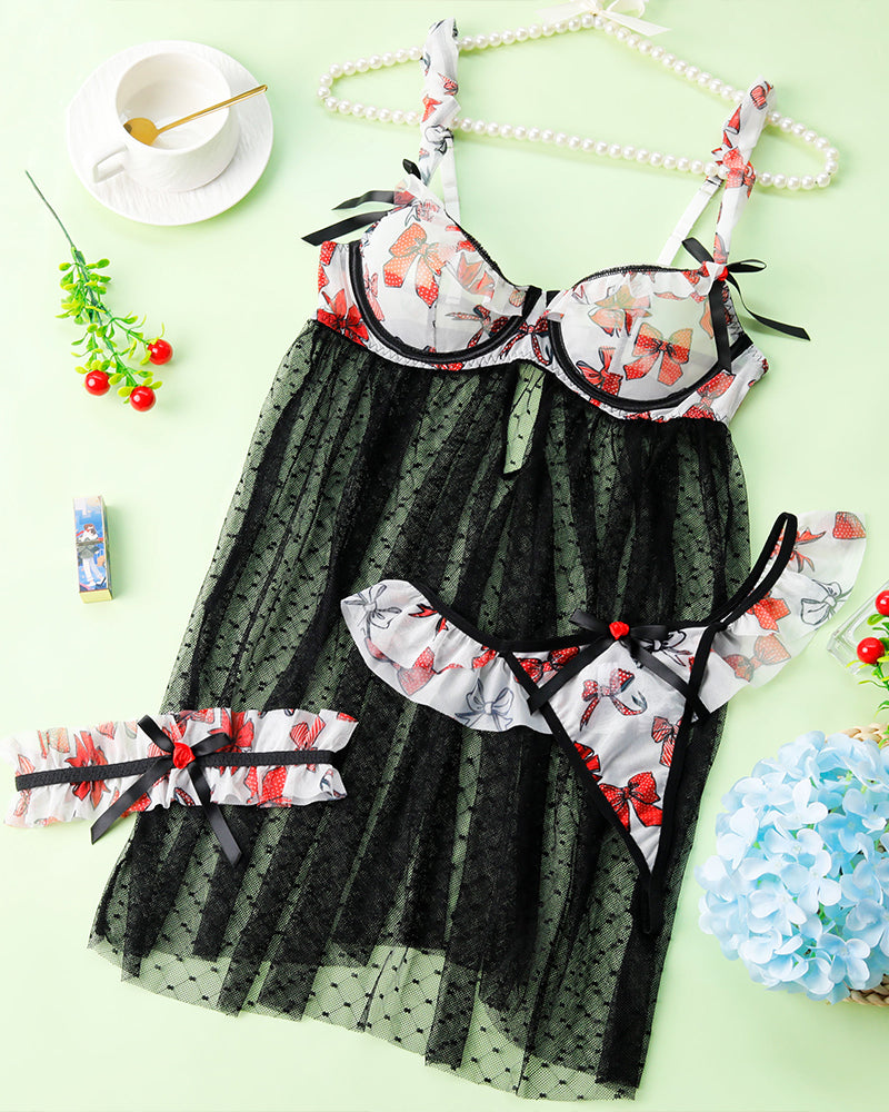 Black sheer nightdress set with red butterfly print and bow-trim garter straps, flat lay