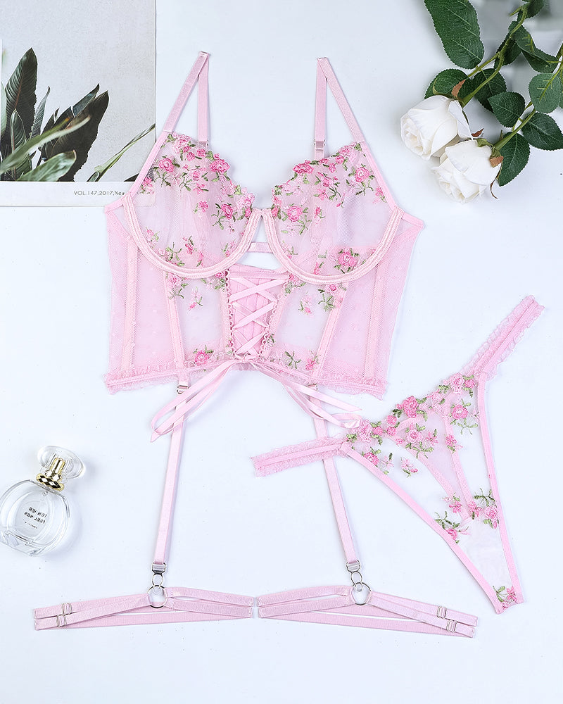 Pink embroidered sheer lingerie set with underwire bra, lace-up front, garter straps, thong