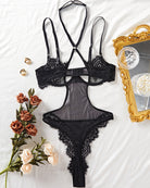 Black lace-trim see-through mesh bodysuit with strappy harness bra and high-cut thong