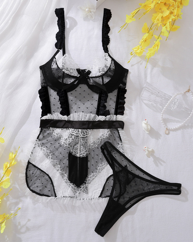 White mesh and black lace lingerie set with bra, ruffle skirt, and matching thong