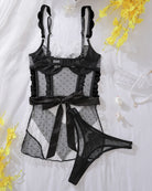 Black and white sheer mesh lingerie set with black lace bra, ruffle skirt, and thong