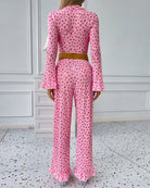 Pink heart-print long-sleeve pajama set with ruffled pants cuffs and elastic waist