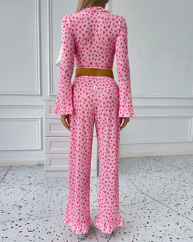 Pink heart-print long-sleeve pajama set with ruffled pants cuffs and elastic waist