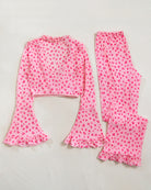 Pink heart-print pajama crop top and wide-leg pants with ruffled flares
