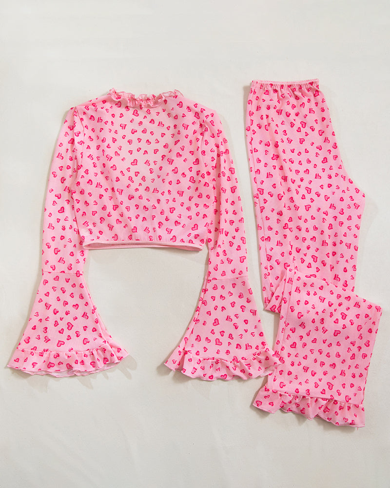 Pink heart-print pajama crop top and wide-leg pants with ruffled flares
